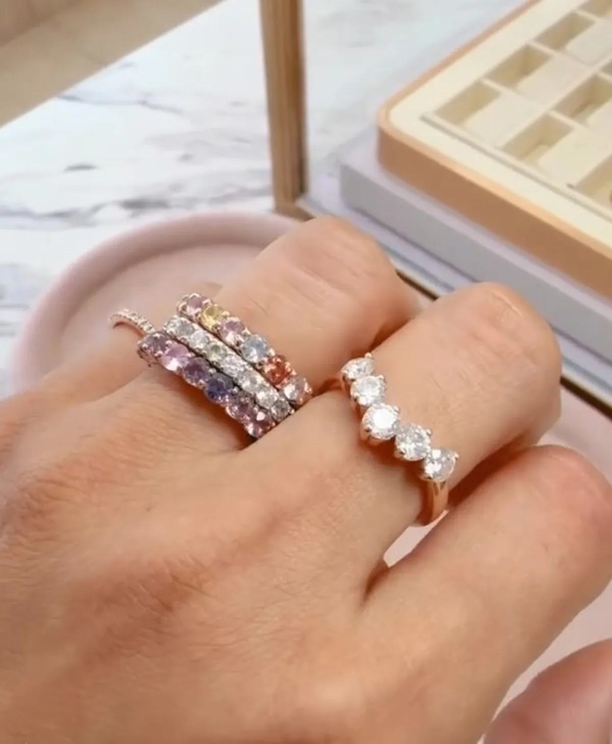 Colored sapphire and diamond eternity wedding bands stacked on hand, Haejin Jewelry Brooklyn
