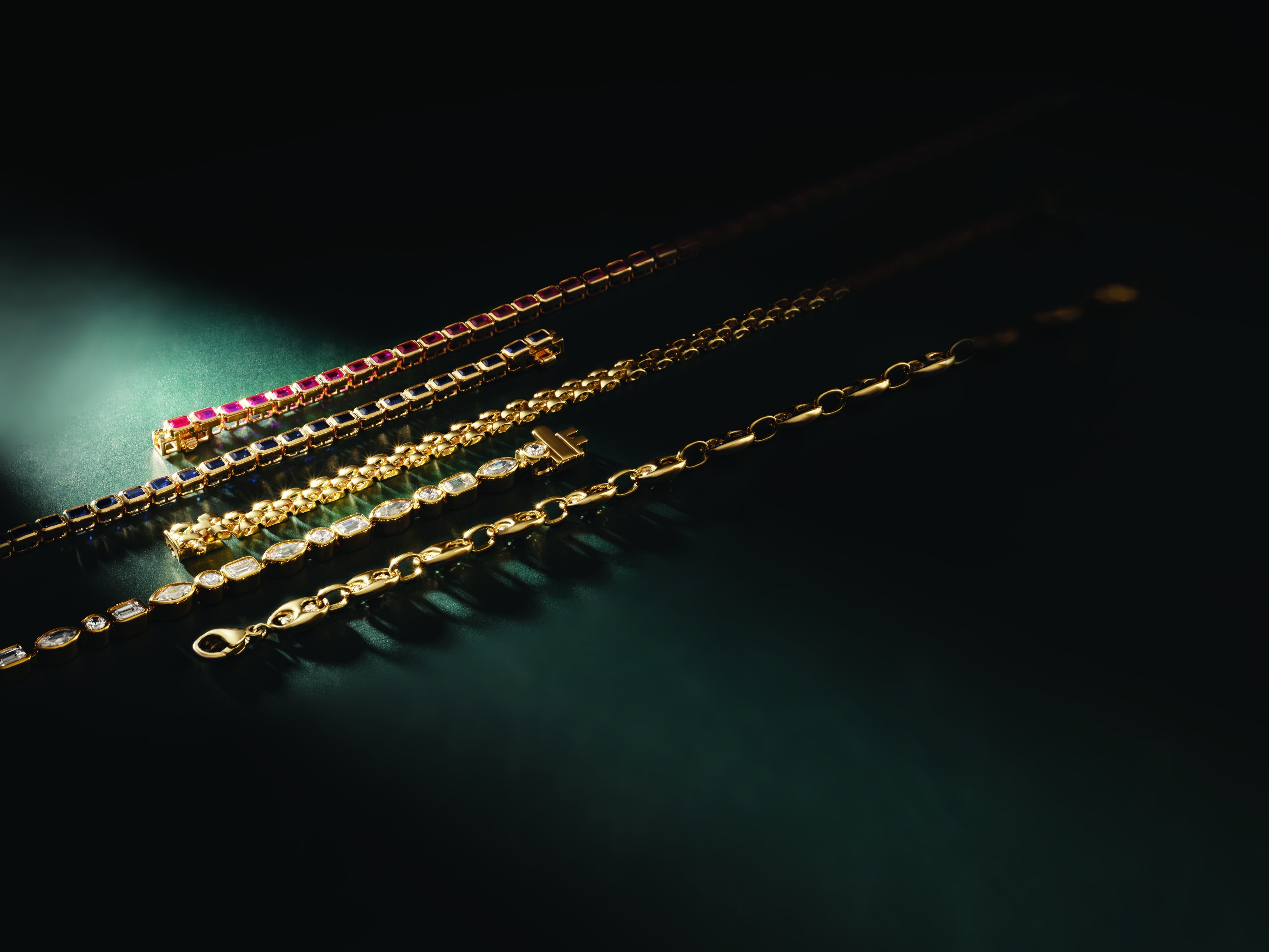 Gold diamond tennis bracelets with ruby and sapphire gemstones at Haejin Jewelry Brooklyn