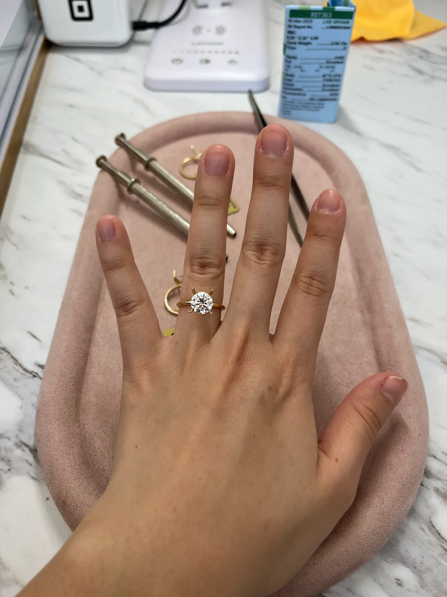 Round brilliant lab-grown diamond solitaire engagement ring tried on at Haejin Jewelry Brooklyn