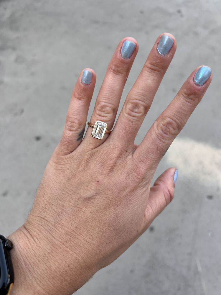 Lauren's custom emerald cut bezel set engagement ring from Haejin Jewelry Brooklyn