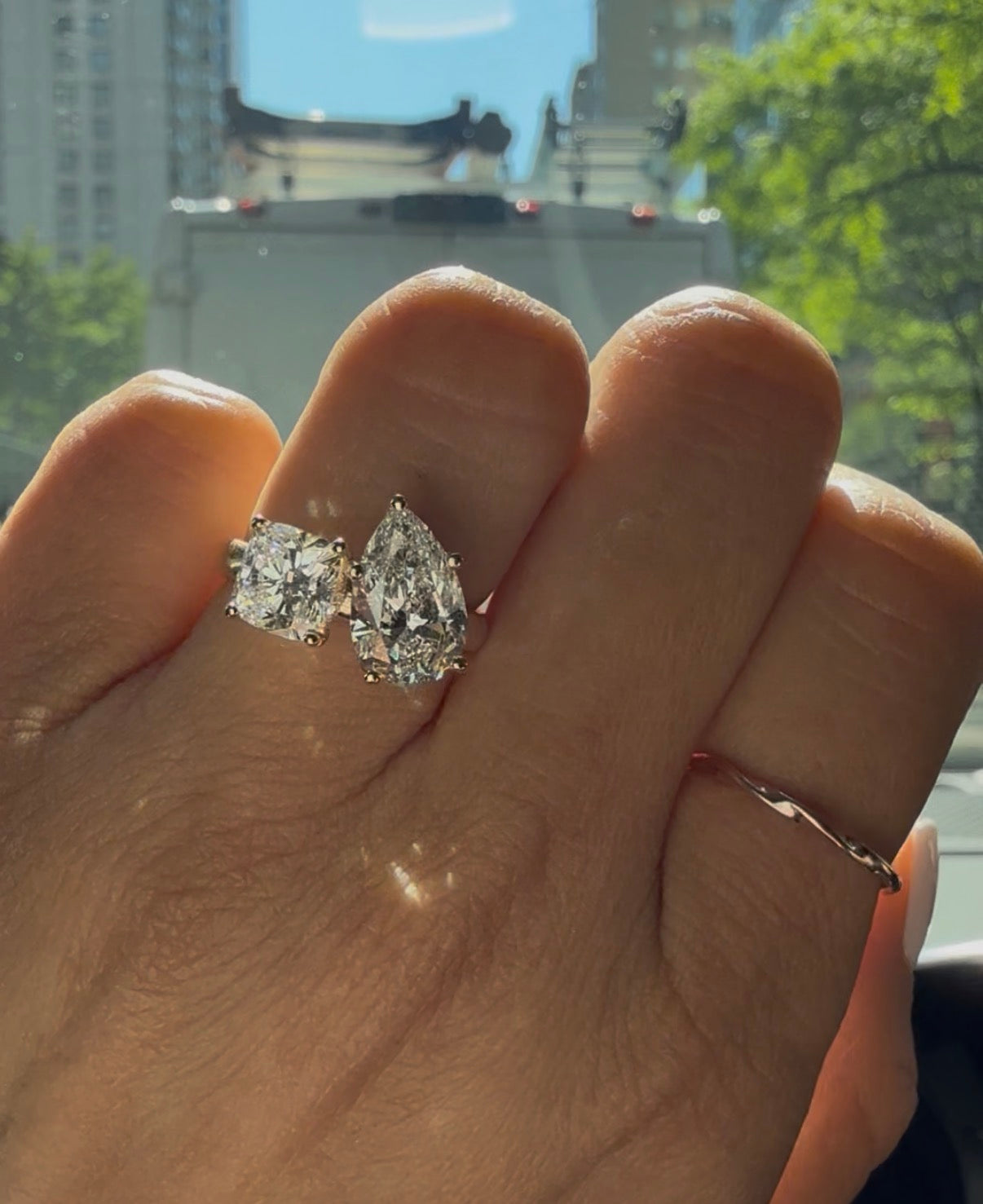 Toi et moi engagement ring with cushion and pear lab-grown diamonds in rose gold, custom designed at Haejin Jewelry in Williamsburg Brooklyn NYC