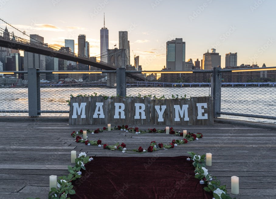 Couple engagement proposal at Brooklyn Bridge at dawn with lab-grown diamond ring