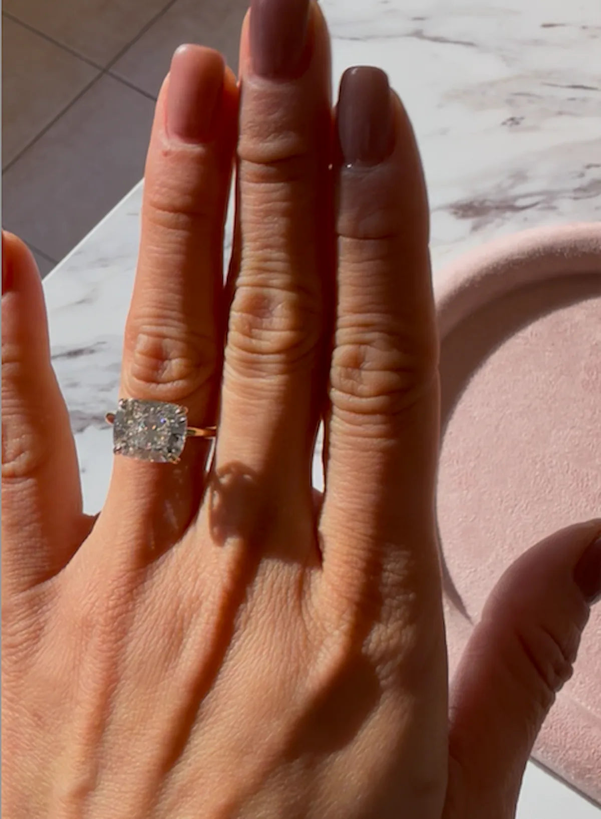 Engagement ring on hand in natural light, NYC guide by Haejin Jewelry in Williamsburg Brooklyn.